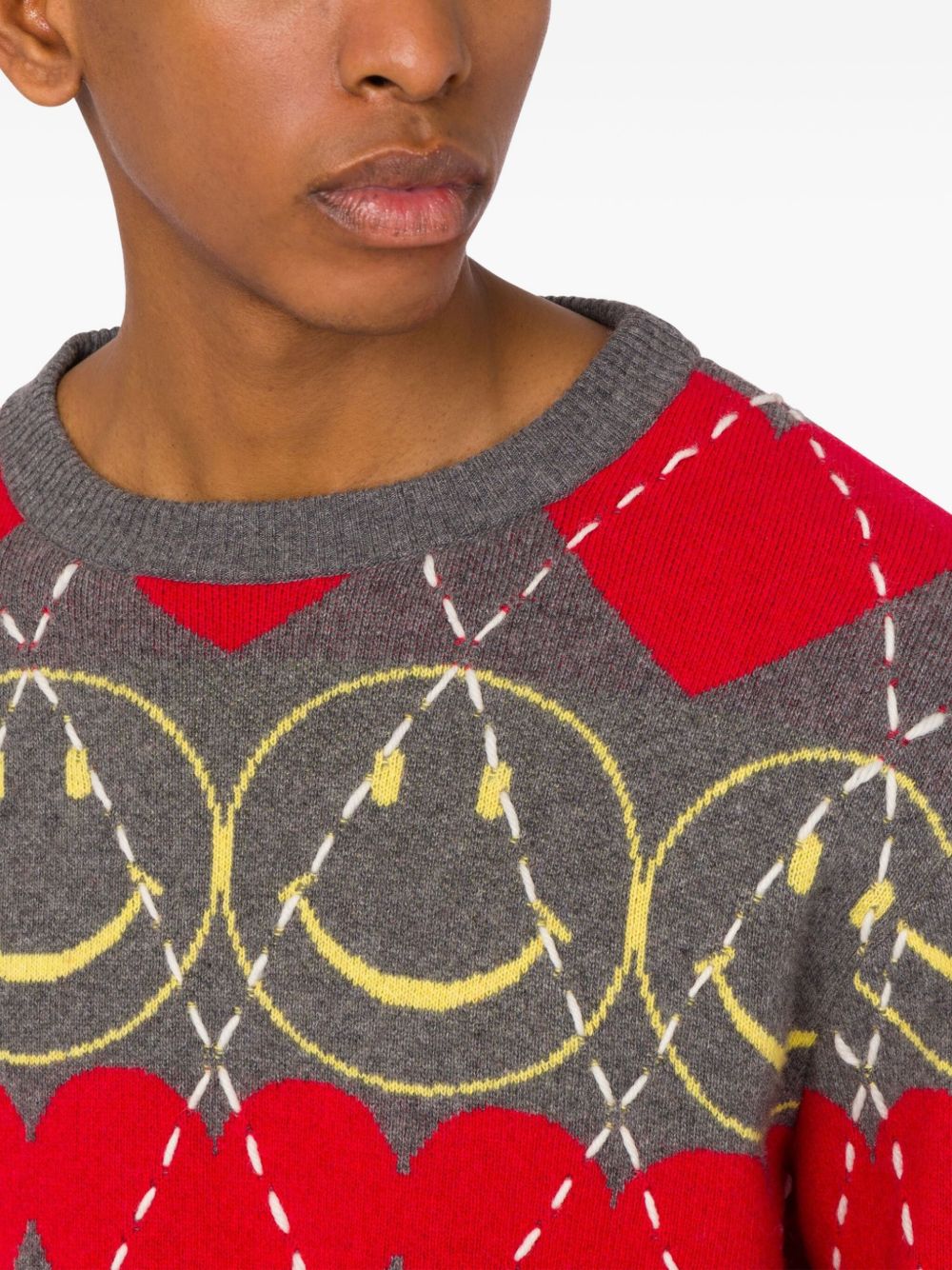 smiley-face heart-pattern sweater