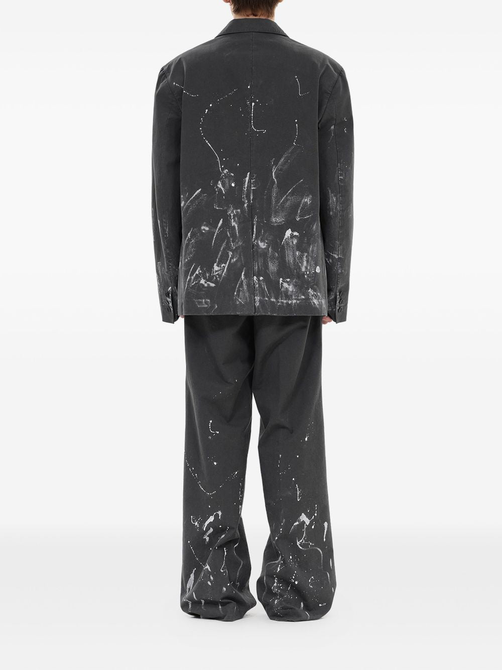 pleated paint-splatter trousers