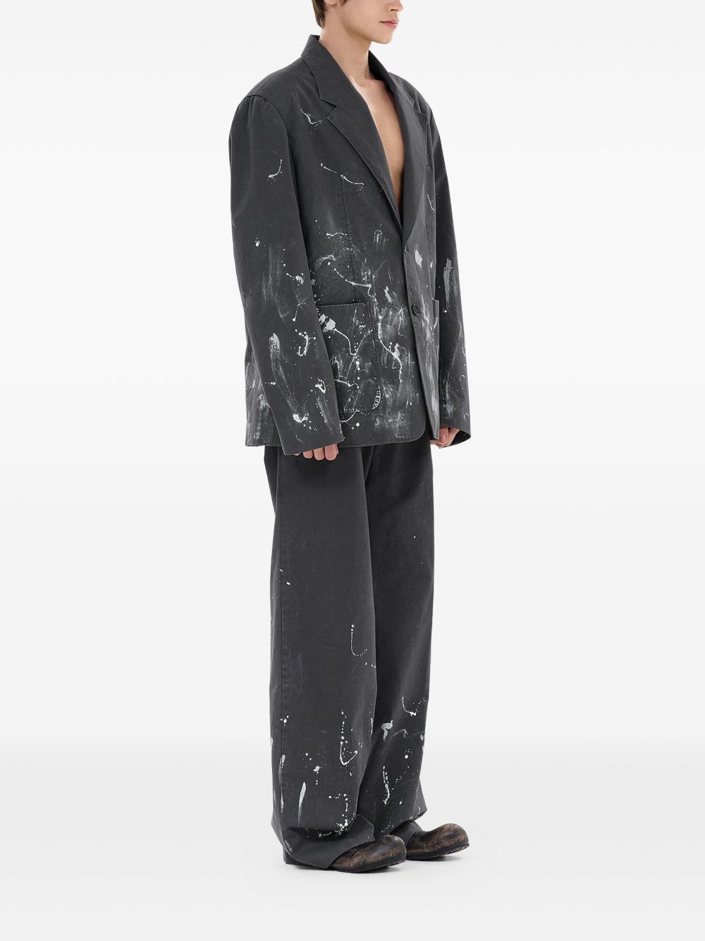 pleated paint-splatter trousers